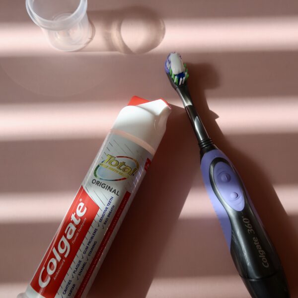 flatlay of toothbrush and toothpaste